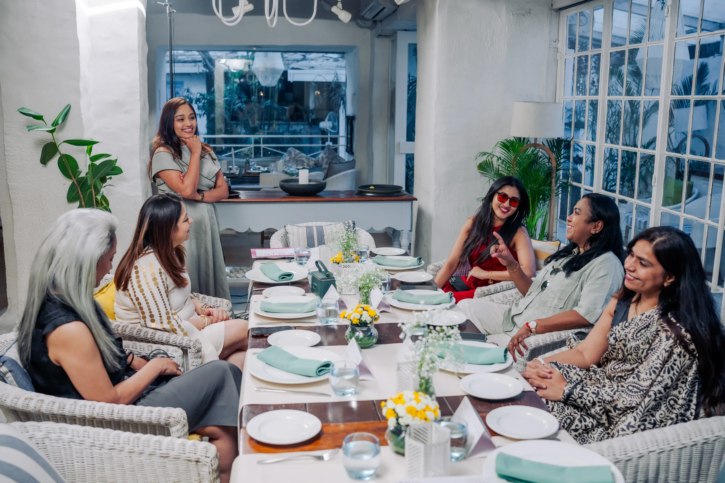 Guests seated around the table, mid-conversation